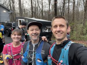Three runners ready to start the race.