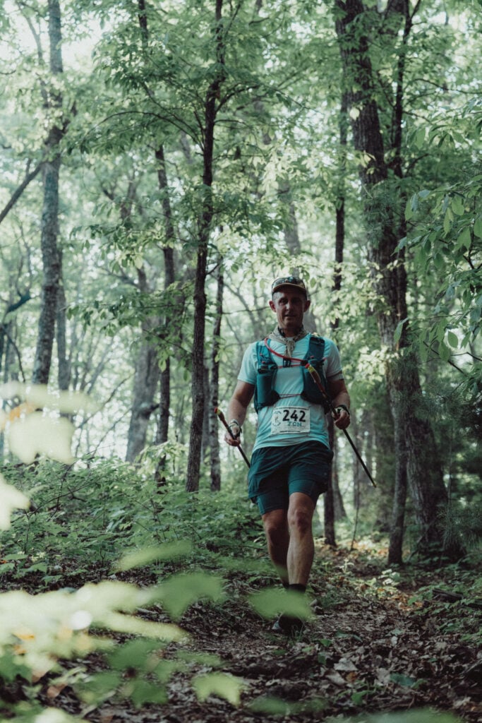 A photo of me running downhill on the Benton MacKaye trail